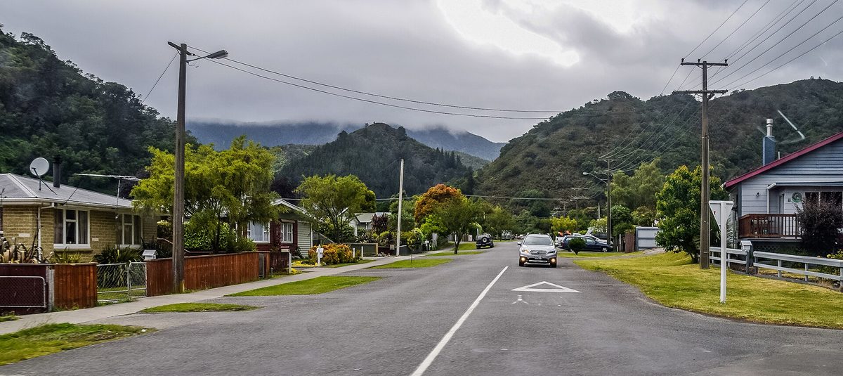 Devon Street in Picton, a quiet residential street with weatherboard houses and bush hills behind