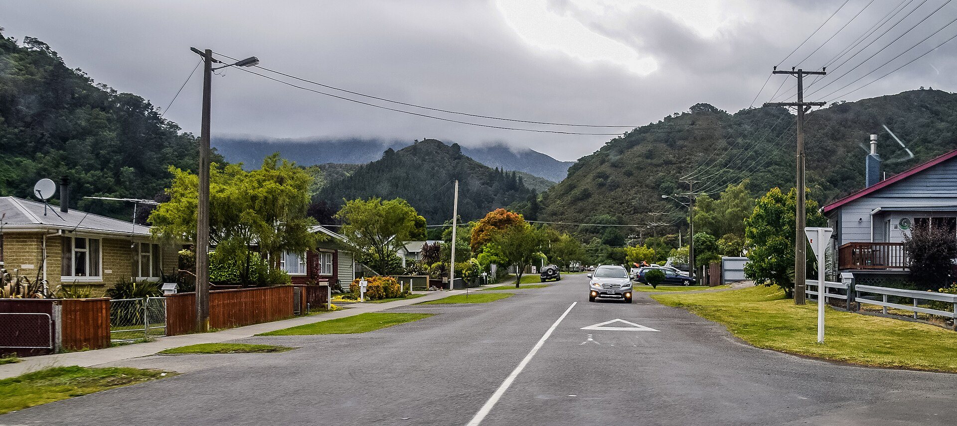 Devon Street in Picton, a quiet residential street with weatherboard houses and bush hills behind
