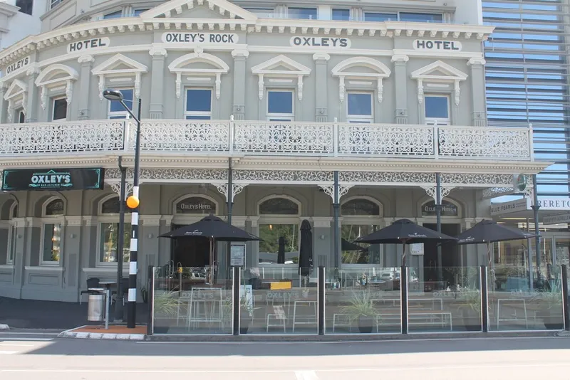 Street-facing historic Oxley's facade, veranda and outdoor seating on London Quay.
