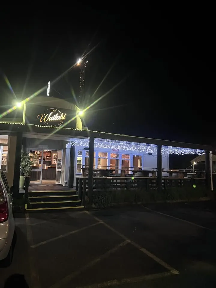 The Waitohi's illuminated Auckland Street frontage, entrance and outdoor deck at night.